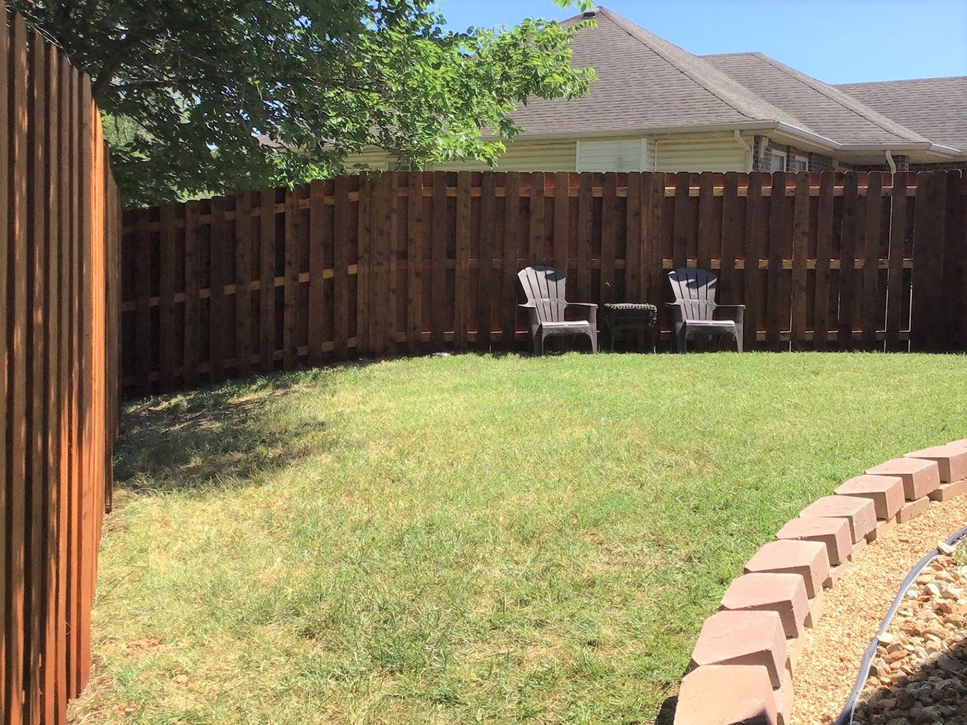 Photo of a Missouri wood fence installed on a slope